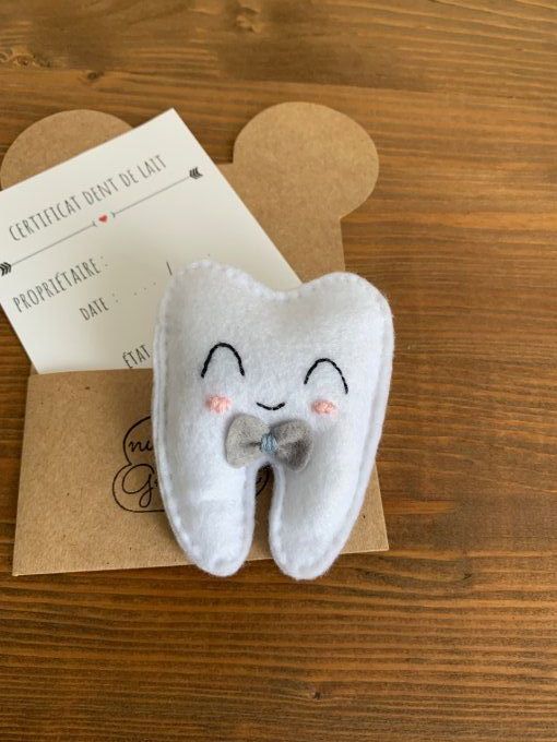 Pochette à dent "nœud papillon" avec certificat 